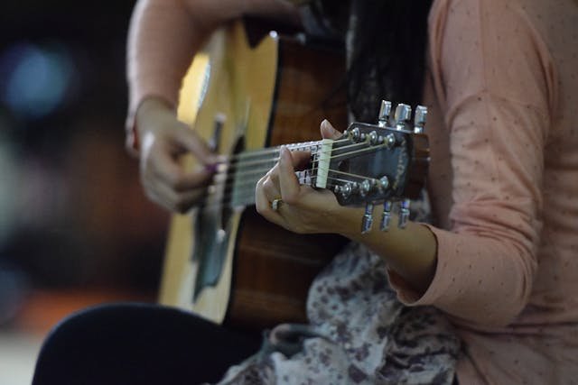 Woman playing guitar